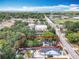Aerial view of the home within a defined property line, near the lake and water tower at 1314 S Mellonville Ave, Sanford, FL 32771