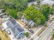 Bird's-eye view of the home surrounded by lush greenery at 1314 S Mellonville Ave, Sanford, FL 32771