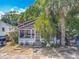 Charming home with mature landscaping and a screened porch at 1314 S Mellonville Ave, Sanford, FL 32771