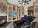 Gathering room with custom built-ins, fireplace, and seating at 14315 Letham Grange Ct, Orlando, FL 32828