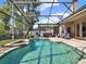 Enjoy this gorgeous in-ground pool surrounded by a screened enclosure and comfortable lounging area at 14315 Letham Grange Ct, Orlando, FL 32828