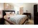Cozy bedroom features a queen bed, natural light, and a writing desk at 1457 Waukon Cir, Casselberry, FL 32707