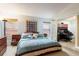 This bedroom features soft blue walls, plush carpeting, and includes an attached office at 1457 Waukon Cir, Casselberry, FL 32707