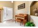 Inviting entryway with a tiled floor, a decorative niche, a piano, and a brightly lit front door at 1457 Waukon Cir, Casselberry, FL 32707
