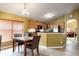 Bright kitchen with wood cabinets, stainless appliances, and an adjacent dining area at 1457 Waukon Cir, Casselberry, FL 32707