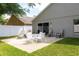 A spacious patio with a table and chairs offers an outdoor space for relaxation and dining at 1457 Waukon Cir, Casselberry, FL 32707
