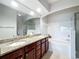 Bathroom featuring double sinks with granite countertops and a shower/tub combo at 163 Villa Di Este Ter # 105, Lake Mary, FL 32746