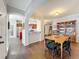 This dining room has hardwood floors and is open to kitchen and living room at 163 Villa Di Este Ter # 105, Lake Mary, FL 32746