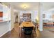 Dining room open to the kitchen with hardwood floors at 163 Villa Di Este Ter # 105, Lake Mary, FL 32746