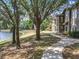Condo with mature trees and landscaping on a beautiful lake at 163 Villa Di Este Ter # 105, Lake Mary, FL 32746