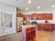 A spacious kitchen with stainless steel appliances and a center island at 163 Villa Di Este Ter # 105, Lake Mary, FL 32746