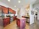 The kitchen features wooden cabinets, granite countertops and stainless steel appliances at 163 Villa Di Este Ter # 105, Lake Mary, FL 32746