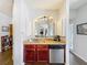 Well-appointed kitchen featuring a sink, dishwasher, and granite countertops at 163 Villa Di Este Ter # 105, Lake Mary, FL 32746