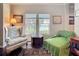 Cozy sitting area with large windows and lake views at 163 Villa Di Este Ter # 105, Lake Mary, FL 32746