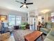 Bright living room overlooking the lake at 163 Villa Di Este Ter # 105, Lake Mary, FL 32746