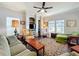 Cozy living room with a ceiling fan and built-in shelving at 163 Villa Di Este Ter # 105, Lake Mary, FL 32746