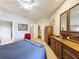 Spacious main bedroom has neutral walls and access to the walk-in closet and en-suite bathroom at 163 Villa Di Este Ter # 105, Lake Mary, FL 32746