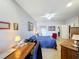 Bedroom with desk and walk-in closet provides plenty of space for work and storage at 163 Villa Di Este Ter # 105, Lake Mary, FL 32746