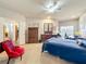 Large main bedroom provides plenty of space and natural light, with ceiling fan and access to en suite bathroom at 163 Villa Di Este Ter # 105, Lake Mary, FL 32746