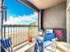 Private patio with scenic lake view, with chairs to sit and enjoy the lake at 163 Villa Di Este Ter # 105, Lake Mary, FL 32746