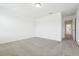 Bright bedroom with neutral carpet and paint, ready for personalization and comfort at 16391 Bird Of Paradise Ave, Clermont, FL 34714