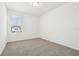 Bedroom with neutral carpet and bright, natural light from a window at 16391 Bird Of Paradise Ave, Clermont, FL 34714
