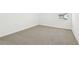 Cozy bedroom with neutral carpet and a window at 16391 Bird Of Paradise Ave, Clermont, FL 34714