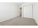 Bedroom featuring neutral carpet, closet, and connecting door to other rooms at 16391 Bird Of Paradise Ave, Clermont, FL 34714