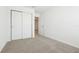 An open bedroom featuring neutral carpet and closet at 16391 Bird Of Paradise Ave, Clermont, FL 34714