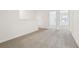 Hallway with plush carpeting, leading to additional rooms, bright and welcoming at 16391 Bird Of Paradise Ave, Clermont, FL 34714
