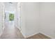 Bright hallway with tile flooring and access to rooms and exterior at 16391 Bird Of Paradise Ave, Clermont, FL 34714