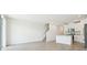 Bright and airy open-concept living room with tile flooring and staircase access at 16391 Bird Of Paradise Ave, Clermont, FL 34714