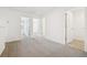Spacious upstairs loft area with carpet and doorways to other rooms at 16391 Bird Of Paradise Ave, Clermont, FL 34714