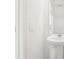 Clean bathroom with a white pedestal sink and minimalist decor at 16399 Bird Of Paradise Ave, Clermont, FL 34714
