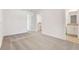 Bright bedroom with neutral carpet, closet, and bathroom access at 16399 Bird Of Paradise Ave, Clermont, FL 34714