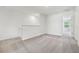 Upstairs landing area with neutral carpet and lots of natural light at 16399 Bird Of Paradise Ave, Clermont, FL 34714