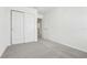 Bedroom with neutral carpet and a closet at 16399 Bird Of Paradise Ave, Clermont, FL 34714