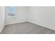 Cozy bedroom with neutral carpet and a bright window at 16399 Bird Of Paradise Ave, Clermont, FL 34714