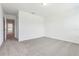 A bedroom with neutral carpet and white walls offers a blank canvas for personalization at 16399 Bird Of Paradise Ave, Clermont, FL 34714