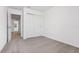 Bedroom with neutral carpet, closet, and hallway access at 16399 Bird Of Paradise Ave, Clermont, FL 34714