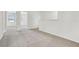 Spacious bedroom with neutral carpet, open doorway, and ample lighting at 16399 Bird Of Paradise Ave, Clermont, FL 34714