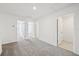 Spacious bedroom with neutral carpet, featuring multiple doorways leading to other rooms at 16466 Bird Of Paradise Ave, Clermont, FL 34714