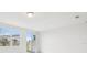 Bright living room featuring a sliding glass door, and large window, offering a view to the outside at 16466 Bird Of Paradise Ave, Clermont, FL 34714