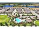 Overhead shot of a neighborhood showcasing a pool, playground, and numerous single-Gathering homes at 16527 Sea Glass St, Winter Garden, FL 34787