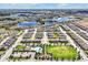 Wide aerial shot of a planned community featuring residences, lakes, pool, and recreation areas at 16527 Sea Glass St, Winter Garden, FL 34787