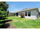 Expansive backyard showcasing lush lawn, mature trees, and a screened enclosure at 16527 Sea Glass St, Winter Garden, FL 34787