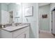 Bathroom featuring white vanity with stone countertop, a single sink and light blue walls at 16527 Sea Glass St, Winter Garden, FL 34787
