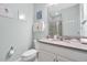 Bathroom featuring a white vanity with stone countertop, a single sink and a comfort height toilet at 16527 Sea Glass St, Winter Garden, FL 34787