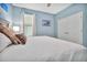 Comfortable bedroom featuring a queen-sized bed with designer pillows, and ample natural light at 16527 Sea Glass St, Winter Garden, FL 34787