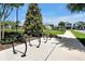 Community bike rack near paved walkway and green space, promoting active transportation and recreation at 16527 Sea Glass St, Winter Garden, FL 34787